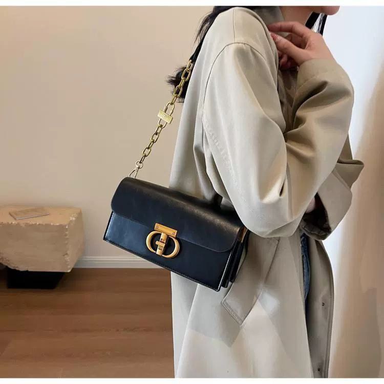 Black Leather Crossbody Bag with Gold Chain & Elegant Clasp