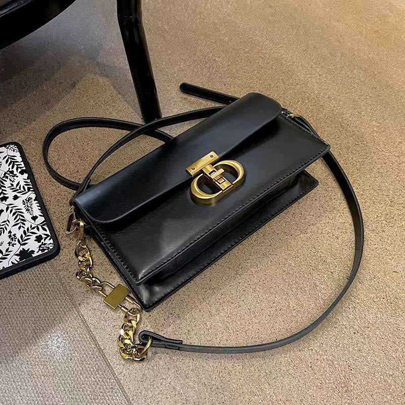 Black Leather Crossbody Bag with Gold Chain & Elegant Clasp